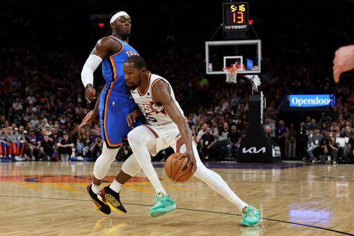 Nov 12, 2023; Phoenix, Arizona, USA; Phoenix Suns forward Kevin Durant (35) drives to the net against Oklahoma City Thunder guard Luguentz Dort (5) during the first quarter at Footprint Center.